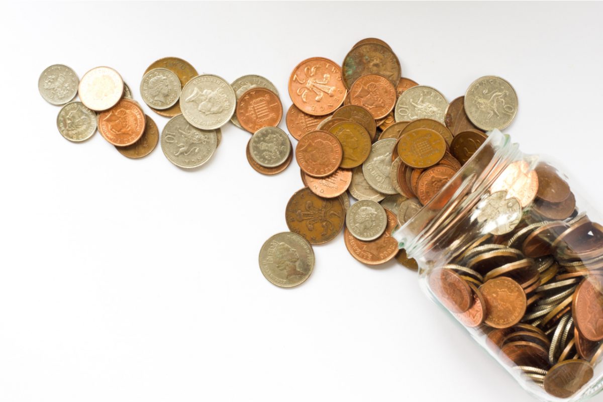 Jar of UK coins tipped over