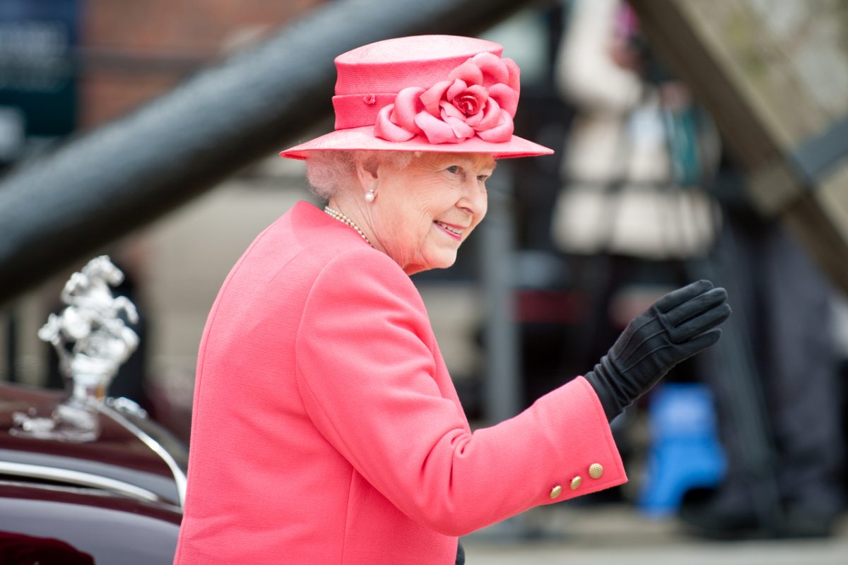 Queen Elizabeth II waving in Liverpool.