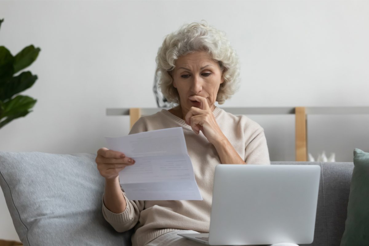 A woman looking at some paperwork.