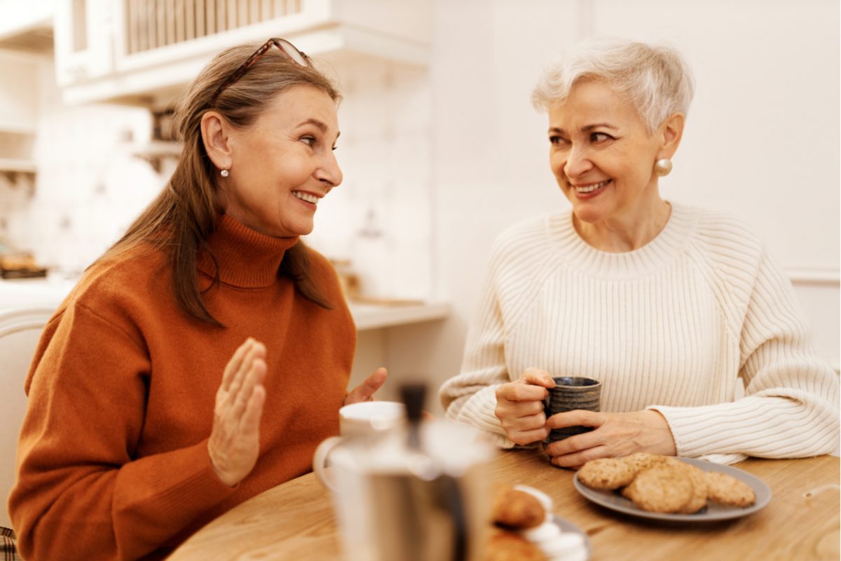 Two women taking over a coffee.