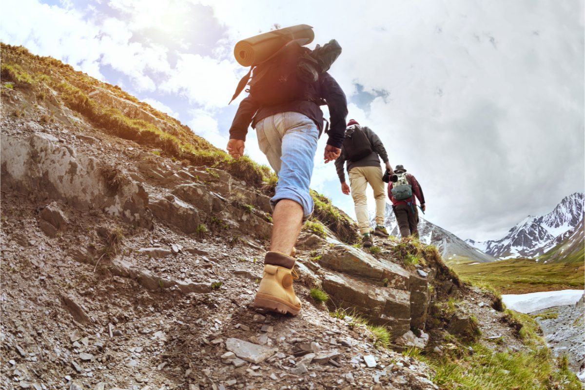 Hikers walking up a hill.