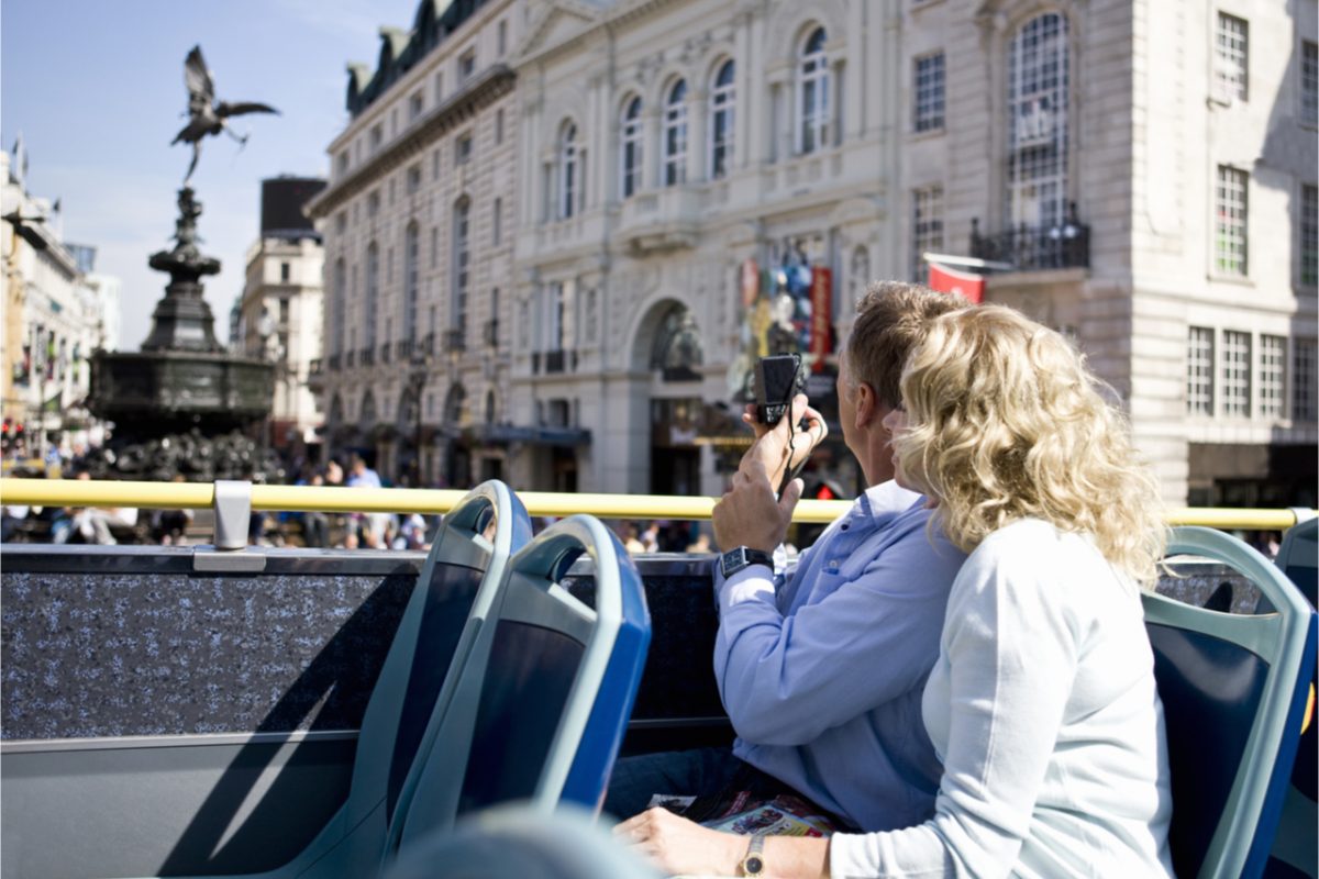 A couple on a sightseeing bus.